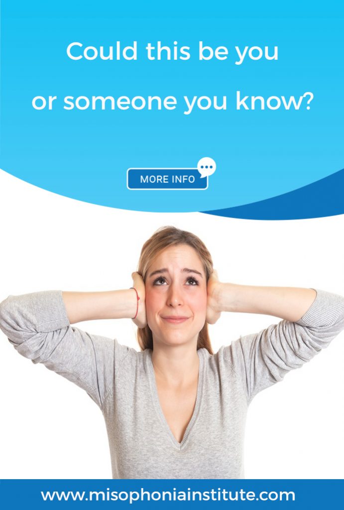 Woman looking stressed and holding hands over ears